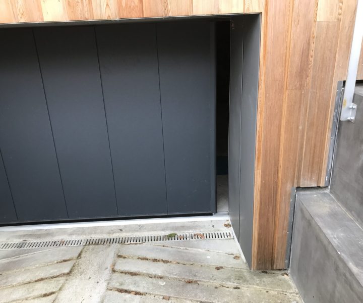 Porte de garage à refoulement latérale